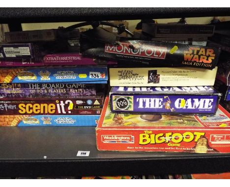 A shelf containing a large collection of board games to include Buffy The Vampire Slayer, Harry Potter, The Bif Foot, Pog the