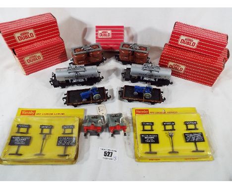 Model railways - a small collection of boxed Hornby Dublo goods rolling stock, comprising two tank wagons # 4679, two low-sid