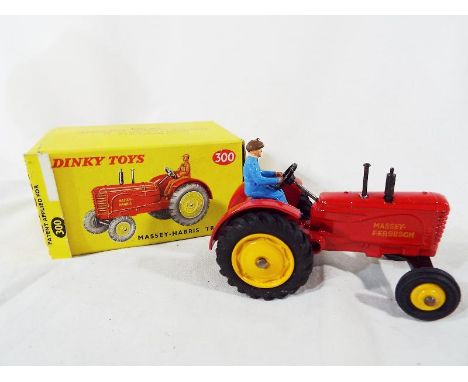 Dinky Toys - a Massey-Harris Tractor, red body, yellow cast and plastic hubs, blue plastic driver, ‘Massey-Ferguson’ decals, 