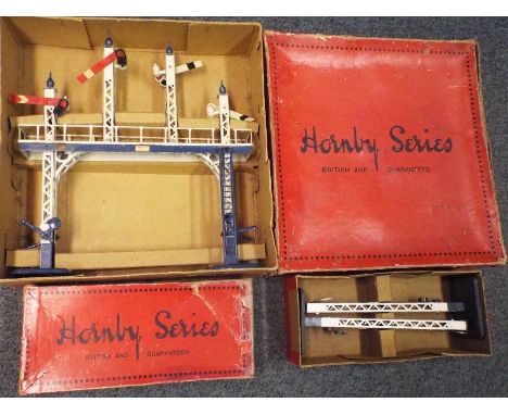 Model railways - a Hornby O gauge tin-plate signal gantry with blue bridge lining, blue bases, ladder and finials, blue lever
