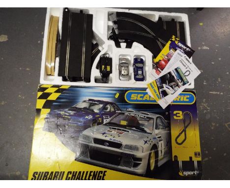 A Scalextric Subaru Challenge twin car set in original box