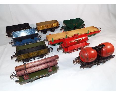 Model Railways - nine Hornby tinplate O gauge goods rolling stock to include a wine wagon and other, circa 1930s (good ++)