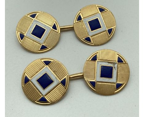 A pair of vintage gold cufflinks with engine turned decoration and white and blue enamel detail to fronts. Worn marks to back