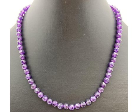 A 16" faceted amethyst beaded necklace with 9ct gold lobster claw clasp. Retired jewellery makers stock. 