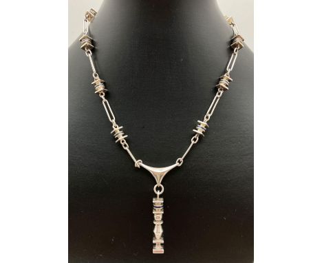 An unusual vintage 925 silver abstract design link necklace with black enamel detail. 16" necklace with 2" drop. Stamped 925 