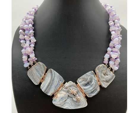 A large silver, amethyst and druzy stone statement necklace, as new. Pendant of 5 large pieces of druzy stone with silver hin