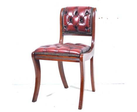 Reproduction mahogany Regency style office chair, back and seat button leather, width 48cm.