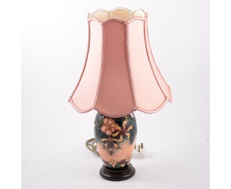 Moorcroft Pottery tablelamp, floral design, wooden plinth, with shade, 49cm overall.