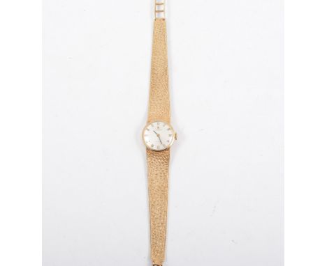 Tissot - A lady's 9 carat yellow gold bracelet watch, circular white baton dial in a 9 carat yellow gold case with integral m