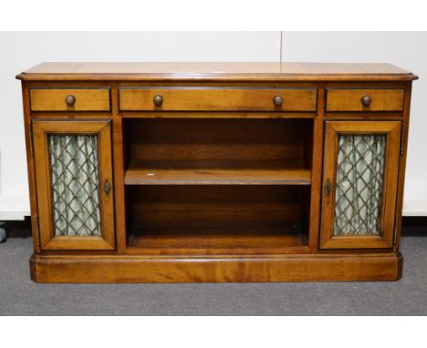 Reproduction walnut sideboard, rectangular top with moulded edge, canted corners, three frieze drawers above an open shelf fl