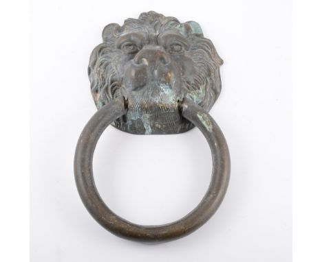 Large cast metal lion's head door knocker, ring mask, 29cm overall.