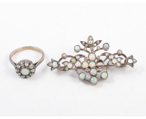 An opal and diamond ring and brooch, the round cabochon cut opals and old and rose cut diamonds set in yellow and white metal