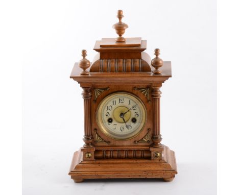 German walnut cased mantle clock, 8 day movement, striking on a gong, urn finials, 39cm