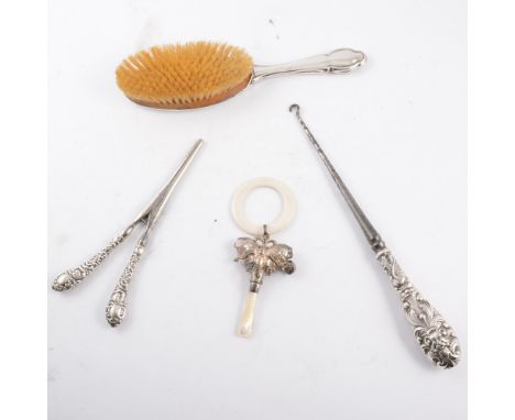 A tray of silver collectables - silver backed hair brush, clothes brush and mirror, glove stretchers and button hook, a silve