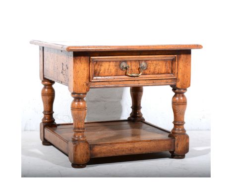 Reproduction oak occasional table, square top with a moulded edge, frieze drawer, turned legs, joined by a shelf, the top 61c