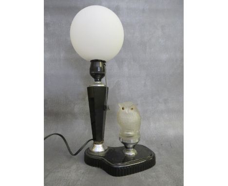 AN ART DECO BAKELITE TABLE LAMP WITH GLASS OWL CAR MASCOT, the glass owl car mascot illuminating alongside a hexagonal stemme