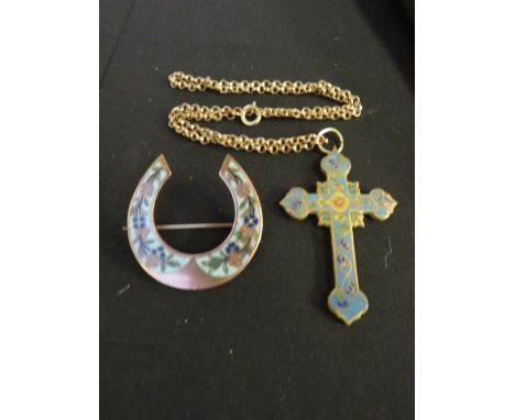 A VICTORIAN CLOISONNE ENAMEL CRUCIFIX ON A CHAIN, together with a horseshoe brooch