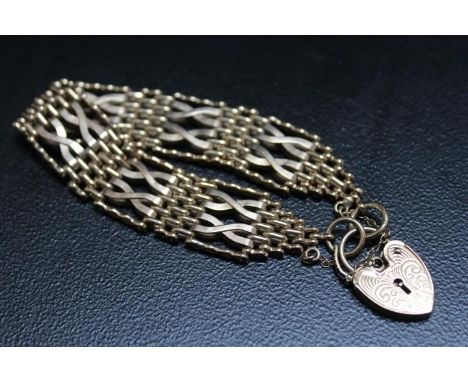 A HALLMARKED 9 CARAT GOLD GATE BRACELET, approx weight 28g