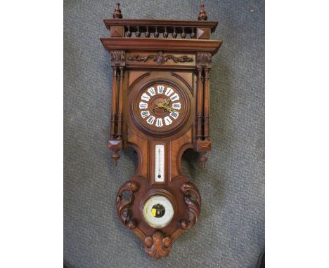 A LATE 19TH CENTURY FRENCH WALL CLOCK WITH BAROMETER AND SPIRIT THERMOMETER, in an elaborately carved oak case, with pendulum