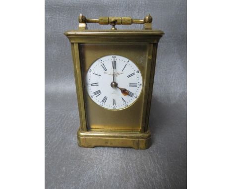 A SMALL 19TH CENTURY FRENCH REPEATER BRASS CARRIAGE CLOCK, with swing handle, H 14.5 cm