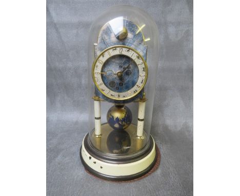 A 400 DAY KAISER UNIVERSE CLOCK WITH GLASS DOME, having a world globe rotating pendulum and upper moon phase subsidiary globe