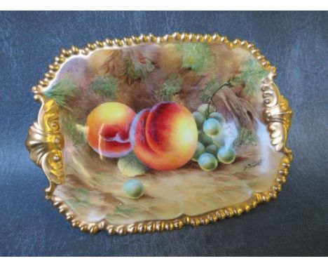 A ROYAL WORCESTER CABINET DISH, decorated by D. Bowker, painted with fruit and gilt decoration, printed black marks to the re