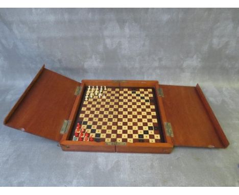 AN EDWARDIAN MAHOGANY TRAVELLING CHESS BOX, with some pieces included, L 30 cm, W 15 cm, D 7 cm