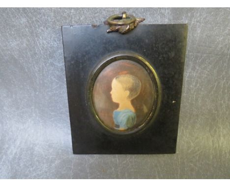 A 19TH CENTURY OVAL PORTRAIT MINIATURE OF A YOUNG CHILD, unsigned, watercolour, framed and glazed, frame with brass finial, 5