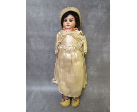 A 19TH CENTURY PORCELAIN BODIED DOLL, with horseshoe mark to nape of neck