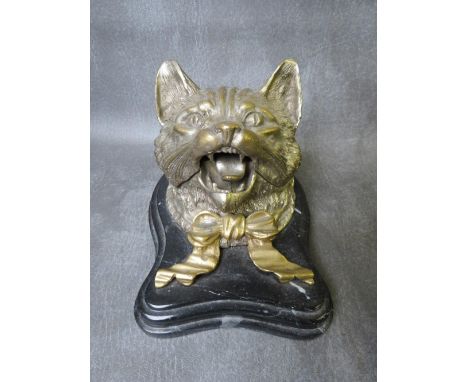 A LARGE VINTAGE NOVELTY CAT INKWELL, the hinged lid opening to a circular inkwell on a shaped stepped marble base, 17 x 13 cm