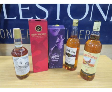 5 ASSORTED BOTTLES OF WHISKY, cognac etc consisting of 1 boxed bottle of Remy Martin VSOP cognac. 1 litre bottle of The Real 