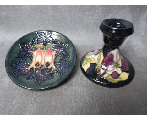 A MOORCROFT 'CLUNY' PATTERN CIRCULAR DISH, Dia. 12 cm, together with a Moorcroft squat candlestick (2)