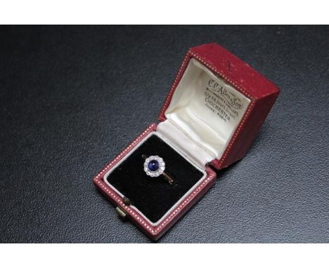 A CABACHON SHAPPHIRE AND DIAMOND RING, set in yellow metal indistictly stamped 18, approx weight 2.2g, ring size R&nbsp;&nbsp