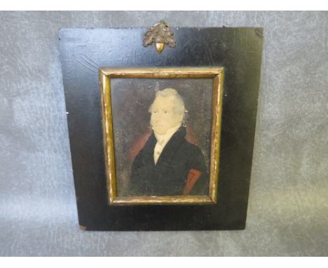 A 19TH CENTURY PORTRAIT MINIATURE OF A GENTLEMAN WEARING A BLACK COAT AND WHITE CRAVAT, unsigned, watercolour, framed and gla