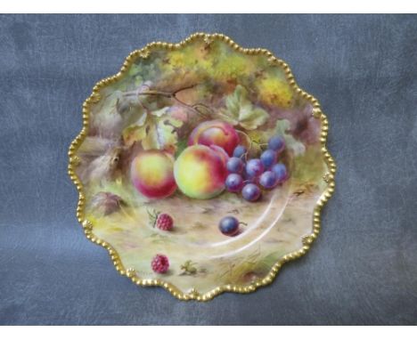 A ROYAL WORCESTER CABINET PLATE DECORATED BY L. FLEXMAN, painted with fruit and gilt decoration, printed puce marks to the re