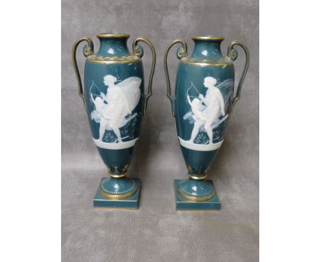 A PAIR OF MINTONS TWIN HANDLED PATE-SUR PATE PORCELAIN VASES, circa 1992, both titled 'Nymph Training Cupid' by Alboin Birks,