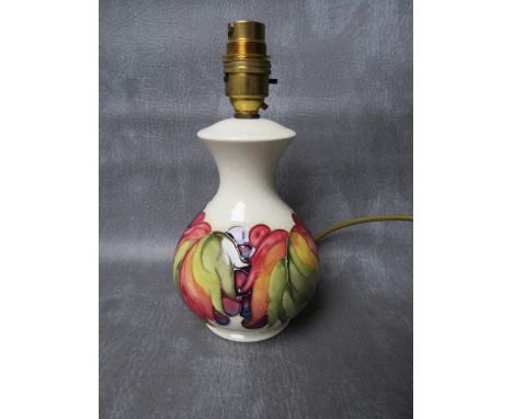 A MOORCROFT LEAF AND BERRY PATTERN TABLE LAMP, impressed marks and remnants of original sticker, no shade, H 16 cm (excl. fit