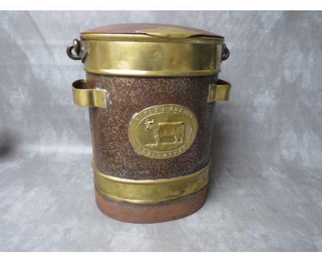 A LATE VICTORIAN BRASS AND STEEL MILK CHURN, of oval form, with hinged lid and swing handle, brass band to top and bottom, wi