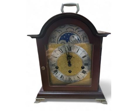 A German mahogany bracket mantel clock, silvered chapter ring, Roman numerals, sun and moon phase, 32cm high, 20th century 