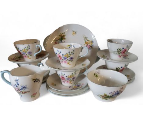 A Shelley Wild Flowers tea service , for six, comprising bread and butter plate, milk jug, sugar bowl, cups saucers and side 