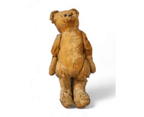 An early 20th century jointed mohair bear, button eyes, small ears, 38cm high, c.1920 