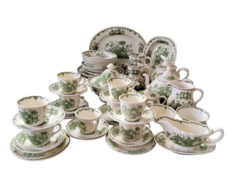 A Mason Ironstone Green Fruit Basket dinner and tea service, comprising nine cups and saucers, two teapots, gravy boat and st
