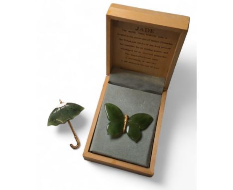 A British Columbian yellow metal and jade brooch in the form of a butterfly; another in the form of an umbrella (2) 