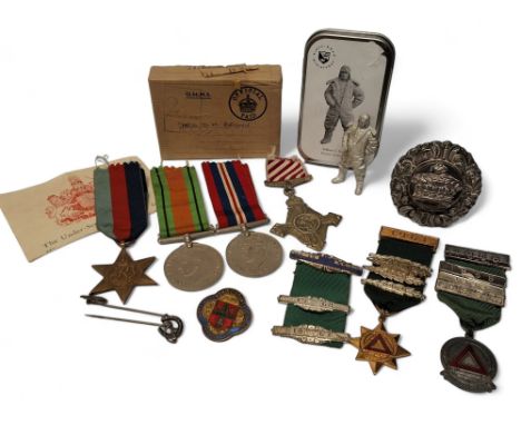 A WWII trio including Defence Medal, War Medal 1939-45, 1939-45 Star, with ribbons, postal box and paperwork; a replica Air F