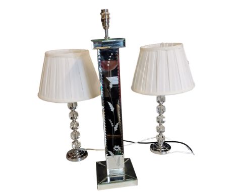 A large mirrored side light, etched with stylised leaves, 60cm high;&nbsp; a pair of perspex and chrome side lights 