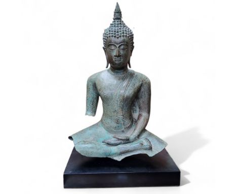 A large 15th century style Thai hollow cast bronze seated Buddha fragment on stand, sat in maravijaya, the hands in bhumispar