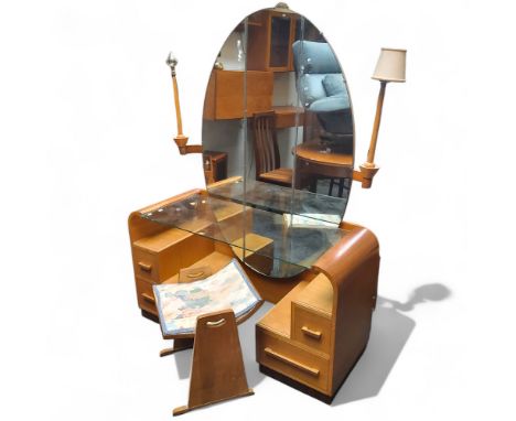 An Art Deco style G Plan E Gomme oak mirrored dressing table, with glass shelf and three piece large oval mirror. Together wi