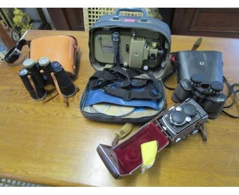 A leather cased Yashica 635 camera, a Miranda 8 x40 wide angle pair of binoculars in a case, Zenlth 12 x 50 field binoculars 