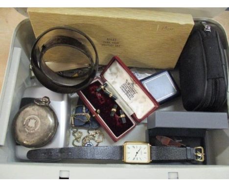 A selection of miscellaneous items to include an engine turned pocket watch, hat pins, a silver bangle and green stone and go