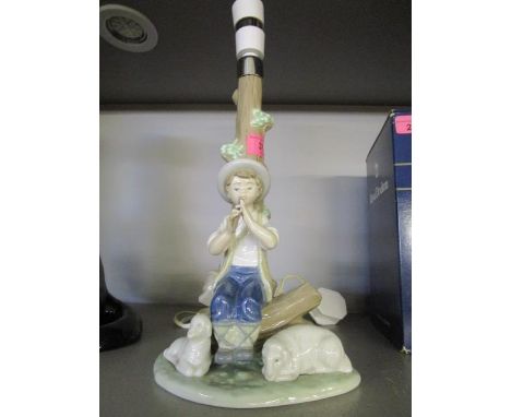 A Nao porcelain figural table lamp of a shepherd boy playing a pipe 